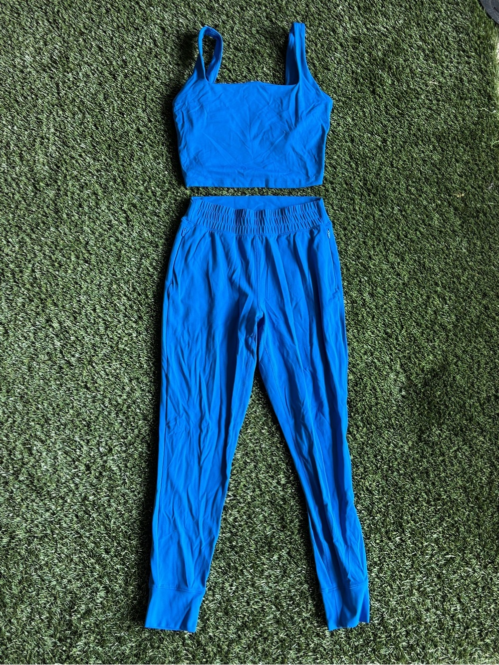 Blue matching athletic set long sleeves, sports bra and joggers